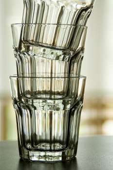 Three clear glasses stacked together.