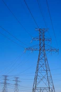 Network of transmission towers and wires.