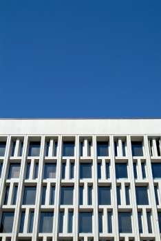 Architectural grid work with blue sky background.