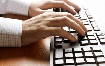 hands of businessman on keyboard, selective focus