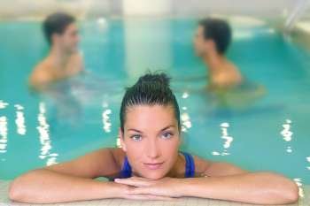 spa woman portrait relaxed in pool water men in background