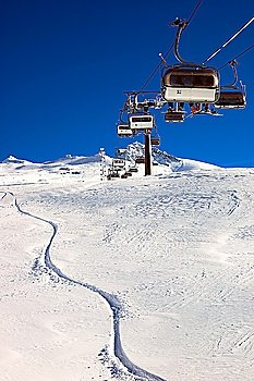 Chair-lift and ski slope; high mountain, winter ski area, Zermatt; Swiss.