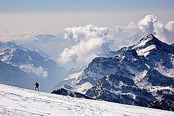 Mountaineer walking on a glacier, West Alps, Swiss.