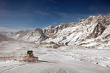 Snow-gun on a ski slope , mountain ski resort