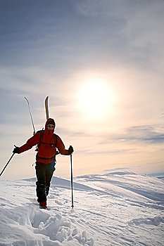 Ski-Climber on a snowy ridge; vertical frame. Italian alps.