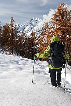 Hiker looking at the wild landscape of Mont Blanc, Italy.