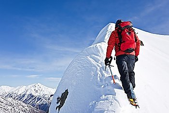 Climber on a snowy ridge, italian alps, Europe. Horizontal frame.