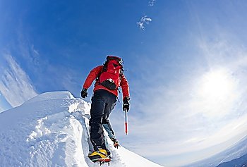 Climber on a snowy ridge, italian alps, Europe. Horizontal frame.