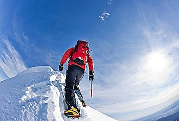 Climber on a snowy ridge, italian alps, Europe (HDR Version). Horizontal frame.
