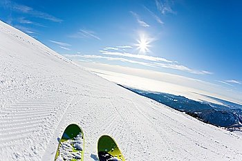 Skiing on a ski slope: closeup perspective, fish-eye lens