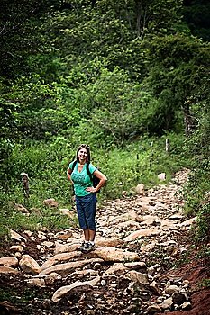 Female hiker on a rugged rustic trail in Costa Rica