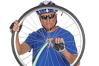 Cyclist looking through wheel
