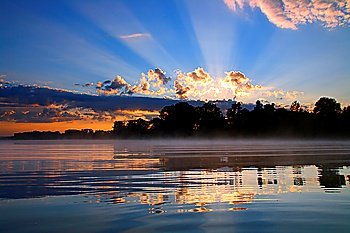 beautiful reflection sunrise with clouds on river