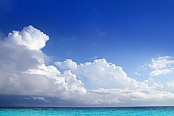 Caribbean aqua sea clouds in blue sky cloudscape horizon