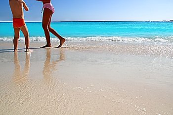 children and teen legs playing Caribbean beach tropical turquoise