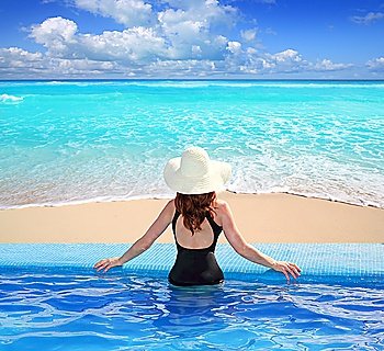 Caribbean tropical sea view from blue pool rear woman beach hat