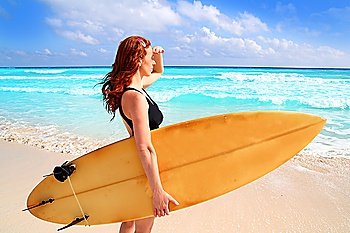surfer woman side view tropical sea looking waves Caribbean sea