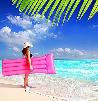 beach hat stand woman floating lounge pink tropical Caribbean paradise
