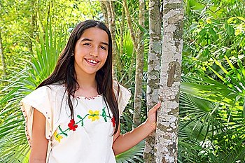 Mexican indian latin girl mayan embroidery dress in jungle Mexico