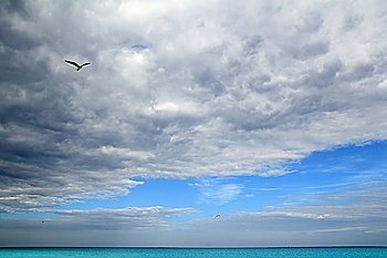 Cloudy dramatic sky in caribbean turquoise sea ocean