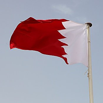 The national flag of Gulf Co-operation Council member Bahrain