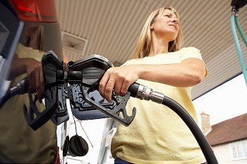 Woman at petrol pump