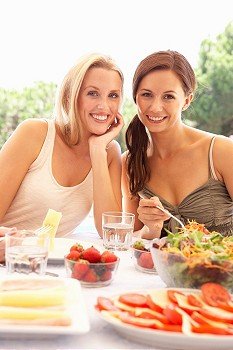 Young women eating outdoors