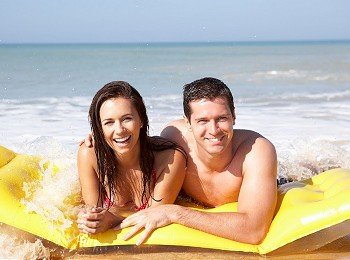 Young couple on beach holiday