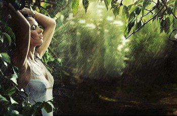 Adorable sexy brunette in a rain forest