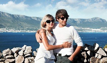 smiling young couple with sunglasses on a vacation trip
