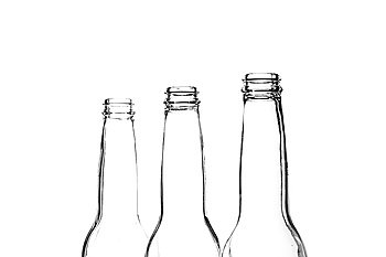 Three beer bottle necks on white
