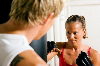 Boxing couple (male / female), trainer supervising the boxing student