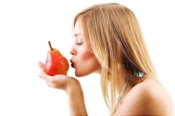 Food, fruit and healthy nutrition - Blond woman holding fruit