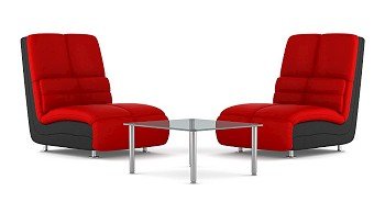 two black and red modern leather armchairs with table isolated on white background