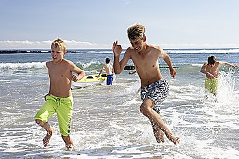 Teenagers playing on beach