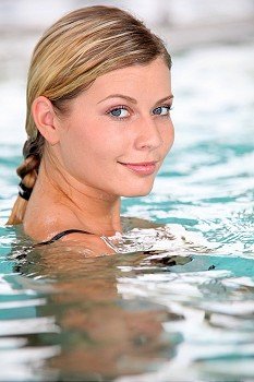 Closeup of beautiful woman in spa center