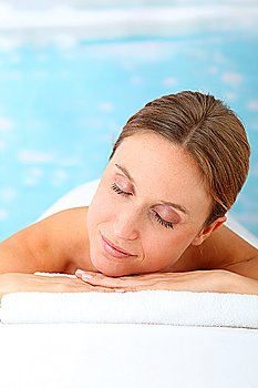 Closeup of beautiful blond woman on a massage bed
