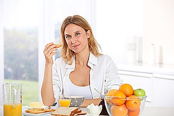 Woman having breakfast in the morning