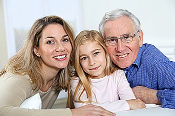 Portrait of smiling grandpa, mother and child