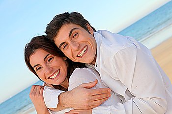 Portrait of lovely couple at the beach in summer