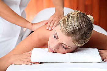 Closeup of beautiful woman laying on a massage bed