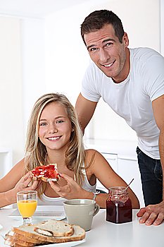 Father and daughter having breakfast