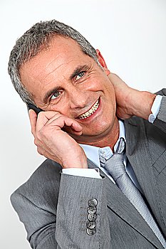 Portrait of mature businessman on the phone