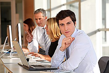 Businessman in the office with laptop computer