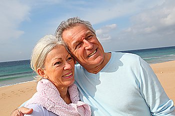 Happy senior couple at the beach