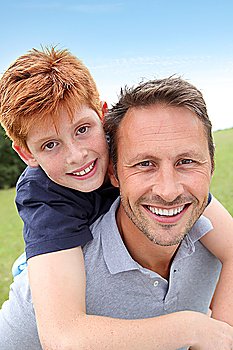 Closeup of father and son in countryside