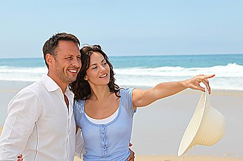 Smiling couple on vacation at the beach