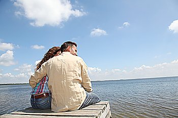 Couple relaxing on a pontoon