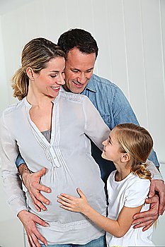 Portrait of family expecting new baby to come