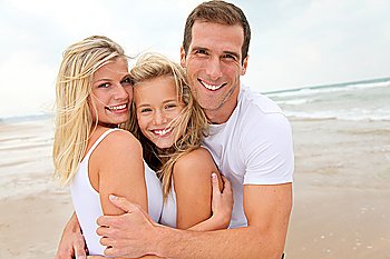 Portrait of happy family at the beach